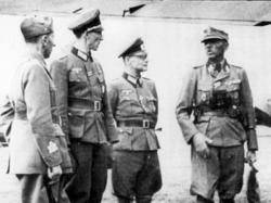A la foto, Waldheim, segon per l'esquerra, amb el general italià Ercole Roncaglia, el coronel Hans Herbert Macholz i el SS-Gruppenführer Artur Phleps en l'aeròdrom de Podgorica, Maig de 1943